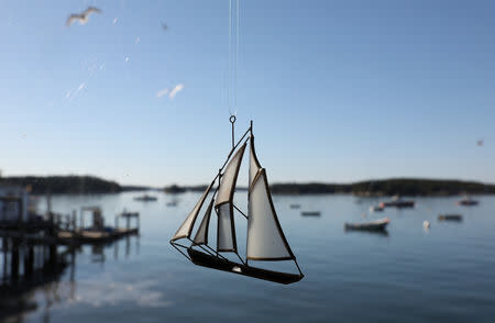 A sailing boat pendant is seen in front of lobster boats sitting in the harbour of Stonington, Maine, U.S., July 5, 2017. REUTERS/Shannon Stapleton