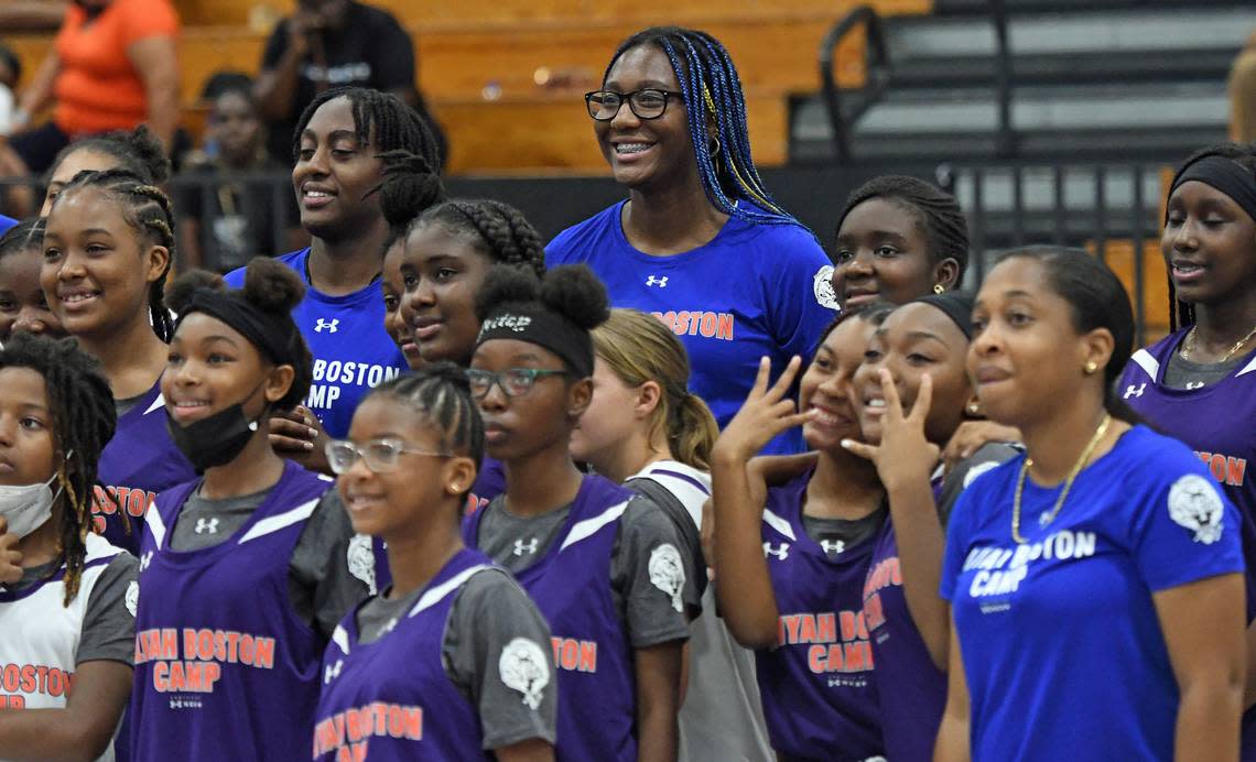 South Carolina forward and St. Thomas native Aliyah Boston, center rear, smiles as she takes a photo with middle school basketball players and camp instructors during Boston’s inaugural UA Next girls basketball camp June 10 at the University of the Virgin Islands’ Sports and Fitness Center on St. Thomas. Under Armour sponsored the camp as part of a larger deal the company has with Boston.