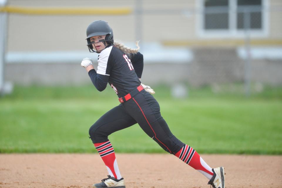 ROCORI's Olivia Schroeder looks at the catcher when she steals second base as the No. 1 seed Spartans hosts No. 3 seed Alexandria in the Section 8-3A semifinals on Tuesday, May 31, 2022, at ROCORI High School.  