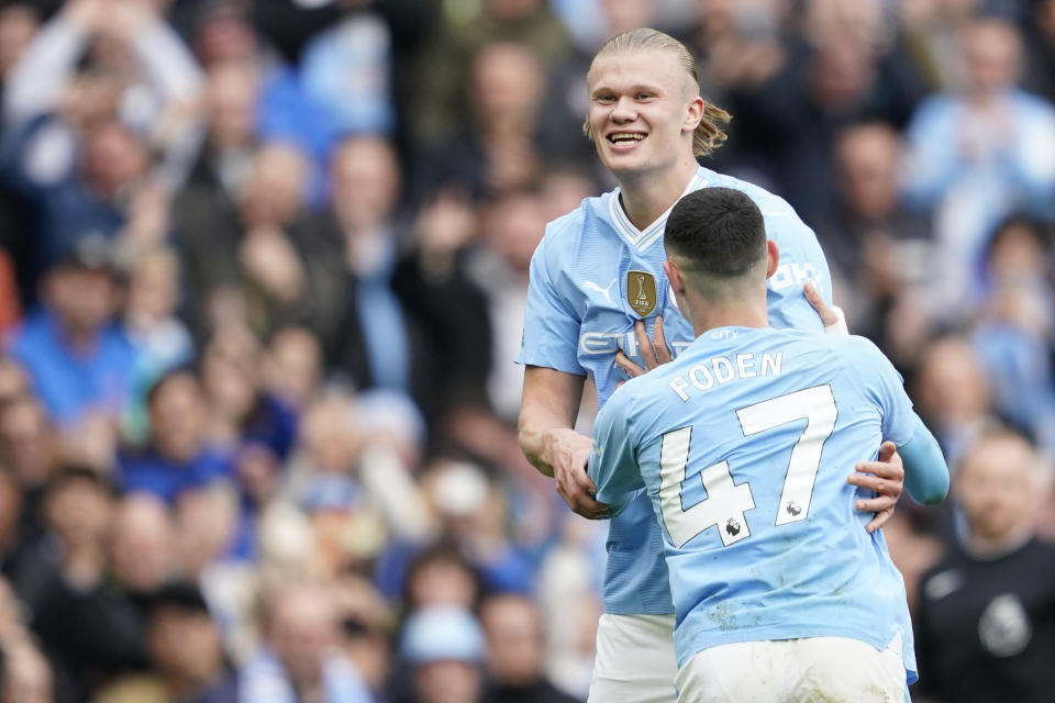 Manchester City's Erling Haaland celebrates after scoring his side's fourth goal during the English Premier League soccer match between Manchester City and Wolverhampton Wanderers at the Etihad Stadium in Manchester, England, Saturday, May 4, 2024. (AP Photo/Dave Thompson)
