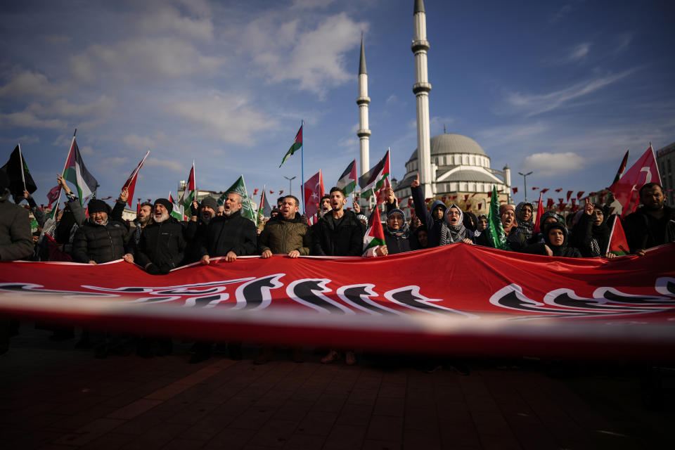 People shout slogans during a protest in support of Palestinians and calling for an immediate ceasefire in Gaza, in Istanbul, Turkey, Sunday, Jan. 14, 2024. (AP Photo/Emrah Gurel)