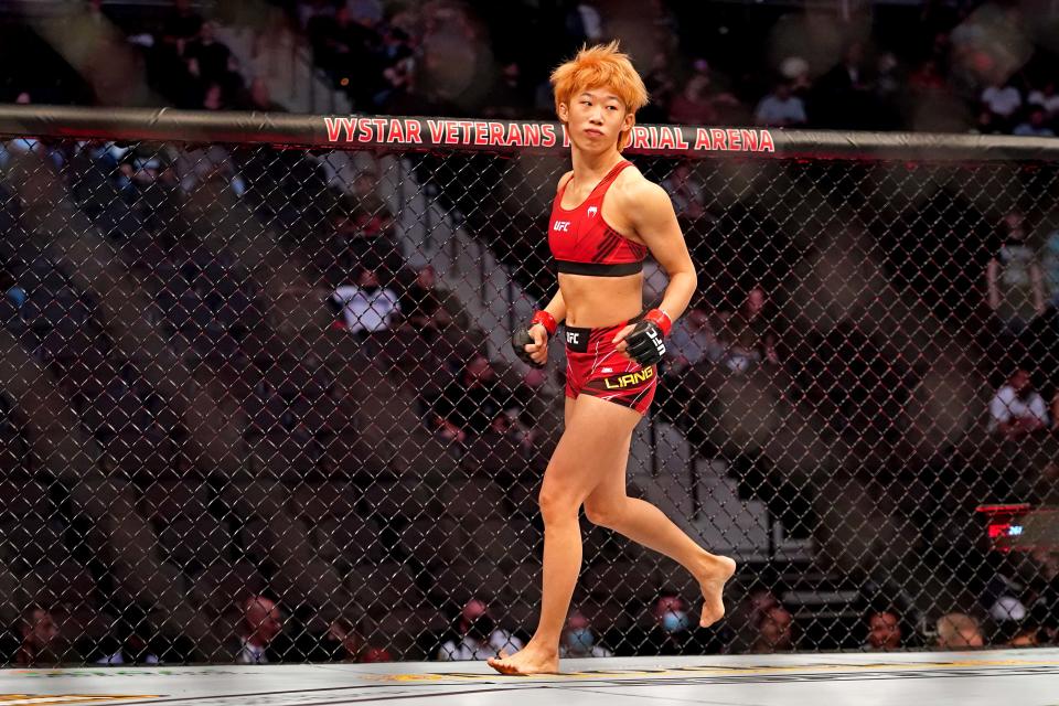 Apr 24, 2021; Jacksonville, Florida, USA; Liang Na (Red Gloves) warms up before fighting Ariane Carnelossi (Blue Gloves) during UFC 261 at VyStar Veterans Memorial Arena. Mandatory Credit: Jasen Vinlove-USA TODAY Sports