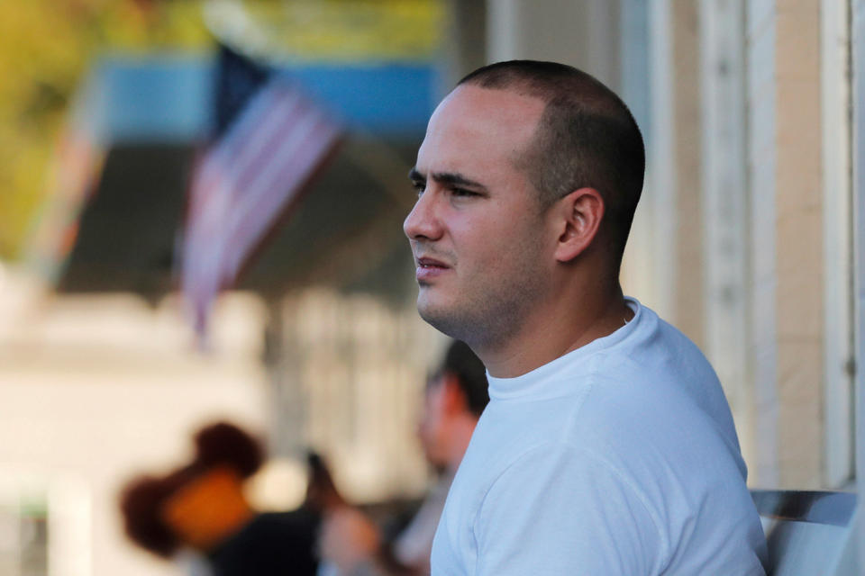 Pedro Cordoves Diaz, a 26-year-old from Cuba who was just released from the Winn Correctional Center, waits at a bus station over 55 miles away, to travel to relatives in New Jersey, in Alexandria, La., Thursday, Sept. 26, 2019. He had been denied parole, but was ultimately given his release on $10,000 bond, paid by relatives in New Jersey. “I stayed in my bed waiting for the moment to leave to arrive,” Diaz said. (AP Photo/Gerald Herbert)