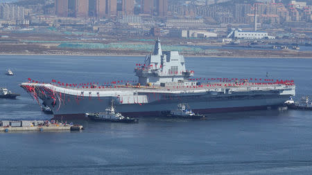 China's first domestically built aircraft carrier is seen during its launching ceremony in Dalian, Liaoning province, China, April 26, 2017. REUTERS/Stringer