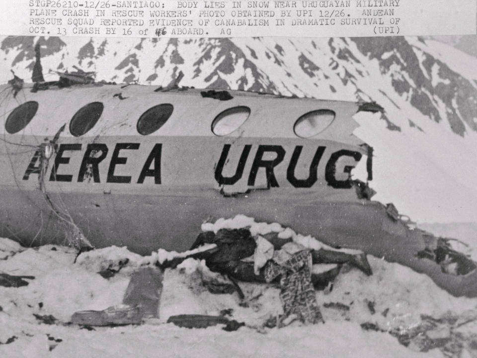 (Original Caption) A decomposing body lies in snow outside the wreckage of the charted Uruguayan plane that crashed here October 13, while flying members of the Old Christian Brother rugby team of Montevideo to Santigao. The 16 young men who lived for 70 days inside the wreckage in the Andes Mountains apparently survived by cannibalizing the bodies of their 29 companions who died in the crash, a spokesman for the Andean rescue squad says December 26.