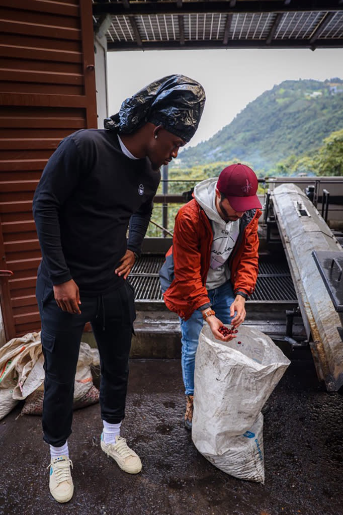 Jimmy Butler (L) sourcing coffee beans in Colombia in Blu Scarpa. - Credit: Courtesy of BigFace Brand