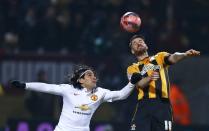 Manchester United's Radamel Falcao (L) challenges Cambridge United's Michael Nelson during their English FA Cup 4th round soccer match at The Abbey Stadium in Cambridge, eastern England January 23, 2015. REUTERS/Andrew Winning (BRITAIN - Tags: SPORT SOCCER)