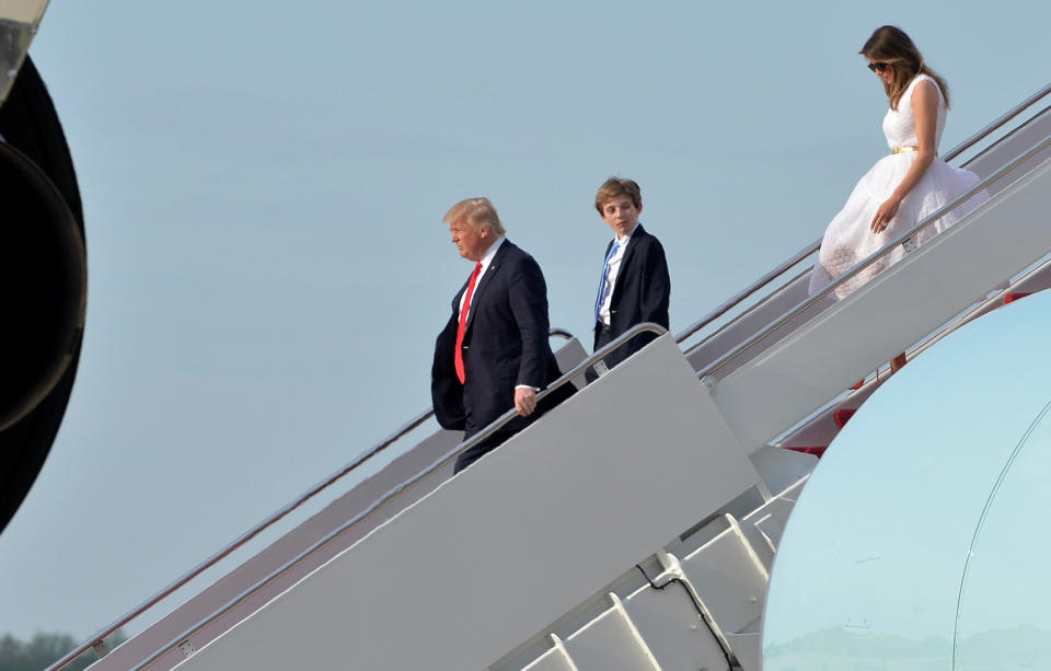 President Donald Trump (L), son Barron (C) and First Lady Melania Trump disembark from Air Force One, after an Easter weekend at his Mar-a-Lago estate in Florida, as they return to Joint Base Andrews, Maryland, in suburban Washington, U.S., April 16, 2017. REUTERS/Mike Theiler