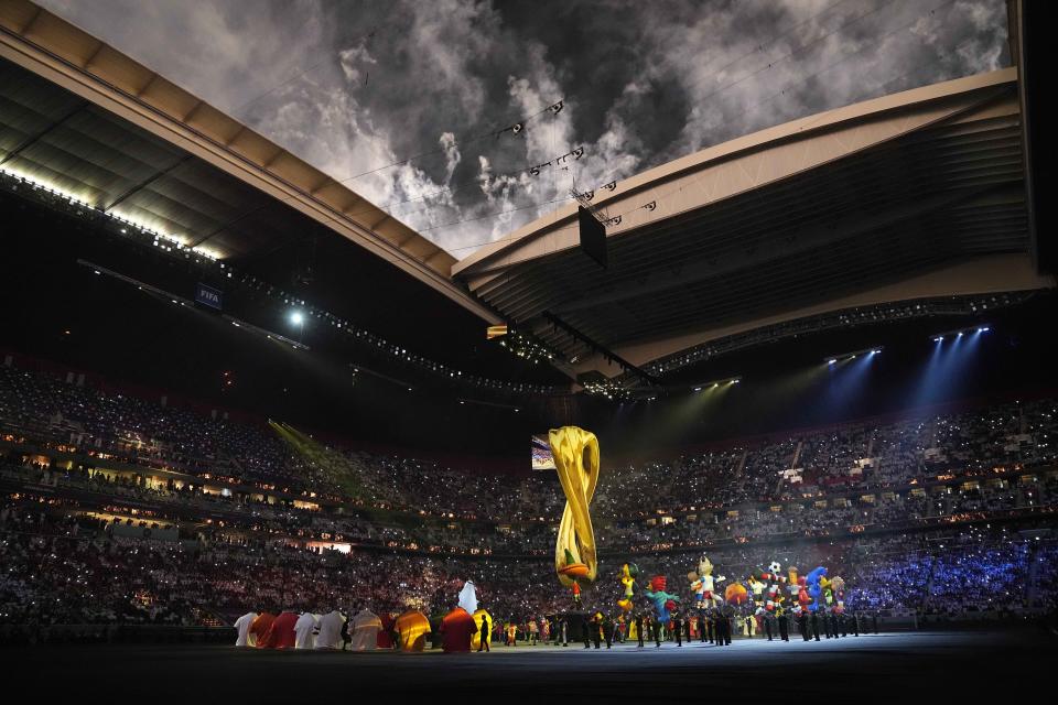 Artists perform prior the start of the World Cup group A soccer match between Qatar and Ecuador at the Al Bayt Stadium in Al Khor, Qatar, Sunday, Nov. 20, 2022. (AP Photo/Darko Bandic)