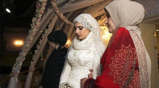 Kheda Goilabiyeva stands after her wedding with Chechen police officer Nazhud Guchigov in Chechnya's provincial capital Grozny on May 16. Photo: AP