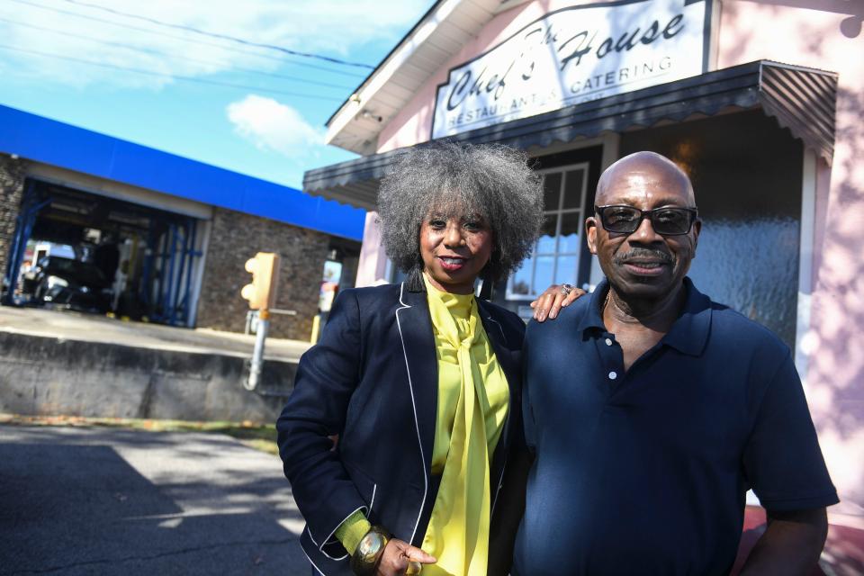 Owners of The Chef House Tammie Darko (left) and husband George Darko (right) pose for a portrait outside The Chef's House on Wednesday, Dec. 6, 2023. The Chef's House, located on Walton Way, serves buffet Southern cooking.