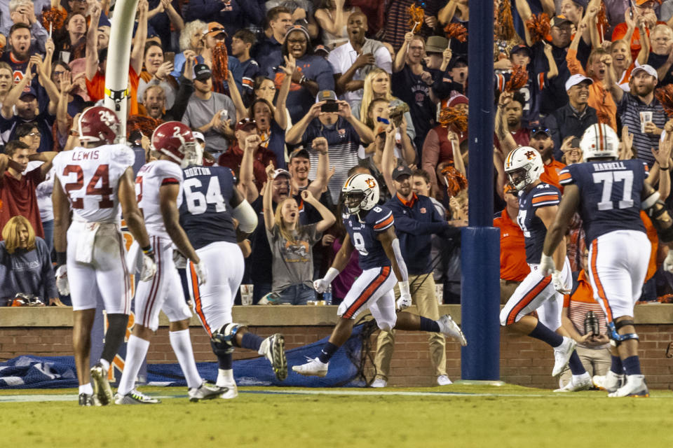 Auburn running back Shaun Shivers (8) celebrates his touchdown run late in the second half of an NCAA college football game against Alabama, Saturday, Nov. 30, 2019, in Auburn, Ala. (AP Photo/Vasha Hunt)