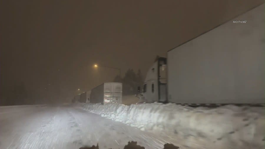 Video shows multiple semi-trucks stranded in feet of snow on Interstate 80 in Truckee, which lies north of Lake Tahoe on the California-Nevada state line. (AIO Filmz)