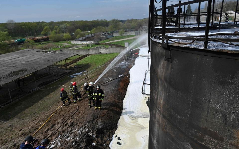 It comes as firefighters are at work to put out a fire at an oil depot near Chuguiv, Kharkiv region, following Russian missile strikes - SERGEY BOBOK/AFP