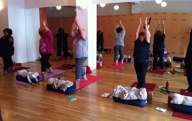 A fat yoga class in action. Photo: facebook.com/buddhabodyyoganyc.