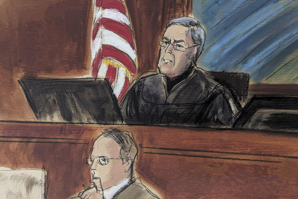 In this courtroom sketch, Judge Lewis Kaplan speaks from the bench during the sentencing of Sam Bankman Fried in Manhattan federal court, Thursday, March. 28, 2024, in New York. Crypto entrepreneur Bankman-Fried was sentenced Thursday to 25 years in prison for a massive fraud that unraveled with the collapse of FTX, once one of the world's most popular platforms for exchanging digital currency. (Elizabeth Williams via AP)