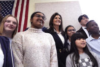 Republican presidential candidate former UN Ambassador Nikki Haley, third left, poses with students during a campaign stop at the Polaris Charter School, Friday, Jan. 19, 2024, in Manchester, N.H. (AP Photo/Charles Krupa)