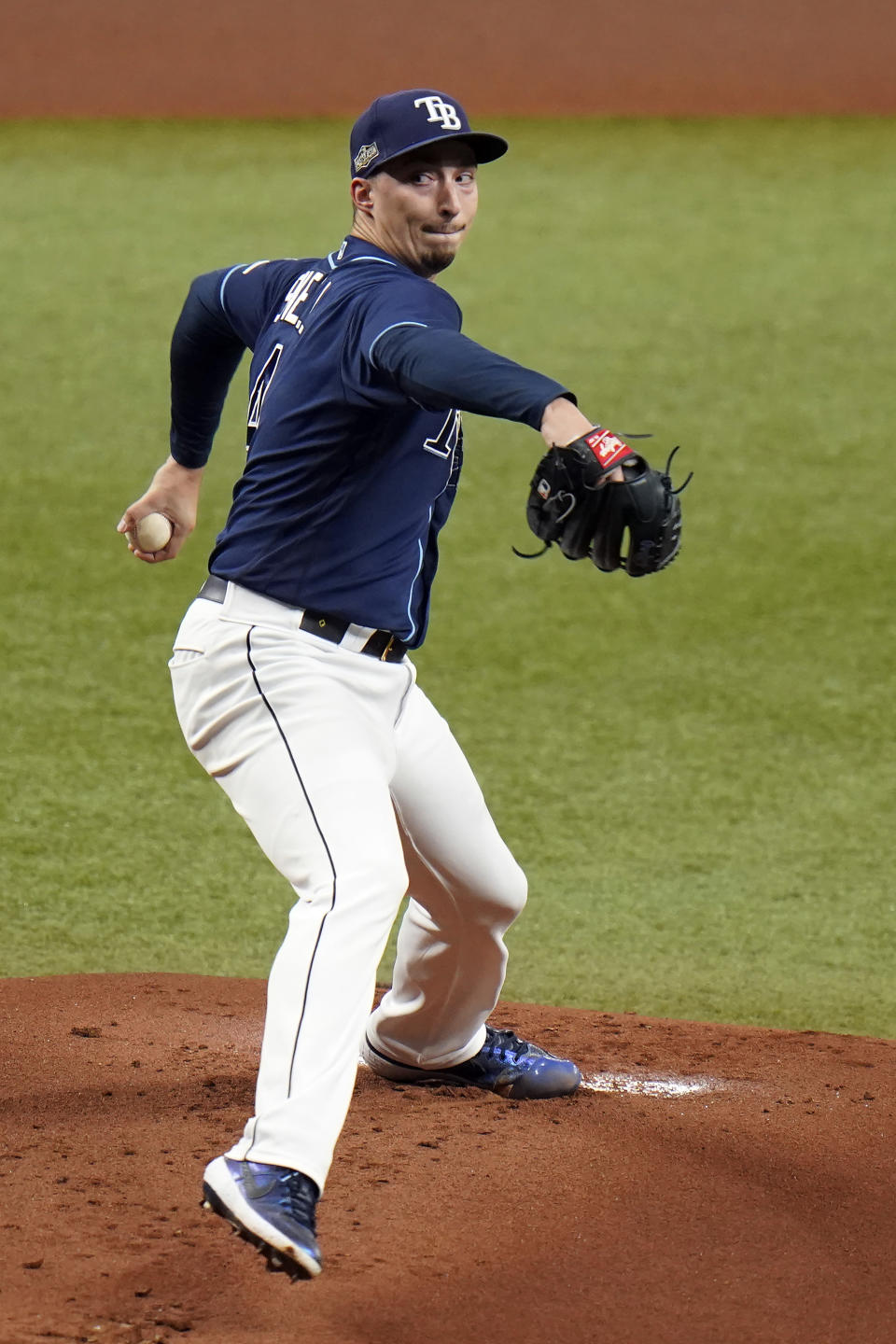 Tampa Bay Rays starting pitcher Blake Snell goes into his windup against the Toronto Blue Jays during the first inning of Game 1 of a wild card playoff series baseball game Tuesday, Sept. 29, 2020, in St. Petersburg, Fla. (AP Photo/Chris O'Meara)