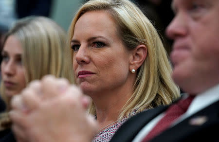 Homeland Security Secretary Kirstjen Nielsen and acting ICE director Thomas Homan (R) listen during an immigration event hosted by U.S. President Donald Trunmp at the White House in Washington, U.S., June 22, 2018. REUTERS/Kevin Lamarque