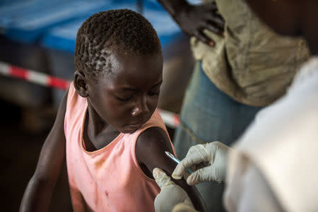 A South Sudanese refugee boy receives a vaccination at the Imvepi refugee settlement camp in Arua District, northern Uganda August 13, 2017. REUTERS/Jason Patinkin