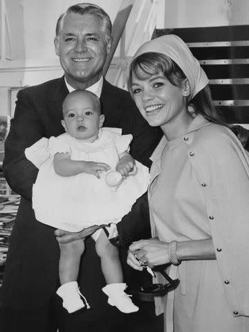 <p>Express/Pictorial Parade/Archive Photos/Getty</p> Cary Grant, Dyan Cannon, and their baby daughter, Jennifer, aboard the P&O liner SS Canberra on September 19, 1966.