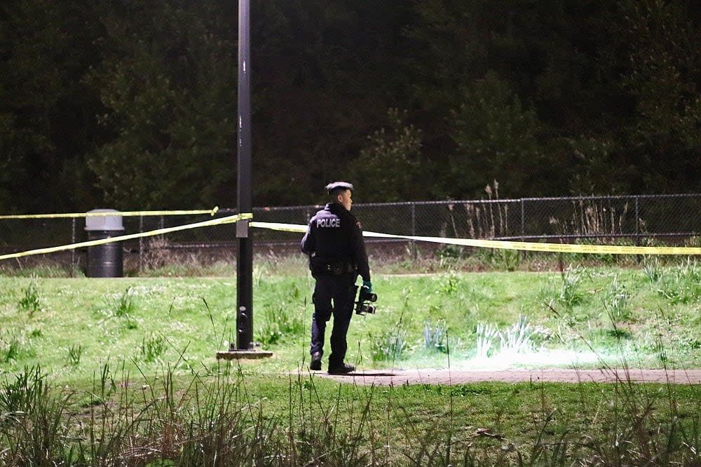 A White Rock RCMP officer is pictured at the scene of a seemingly random stabbing near the city's pier on Sunday, April 21, 2024. (Shane MacKichan - image credit)