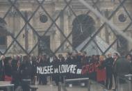 Striking workers block entry to Louvre Museum in Paris