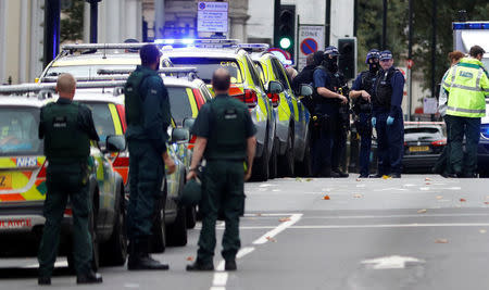 Police officers stand in the road outside the Natural History Museum, after a car mounted the pavement injuring a number of pedestrians, police said, in London, Britain October 7, 2017. REUTERS/Peter Nicholls