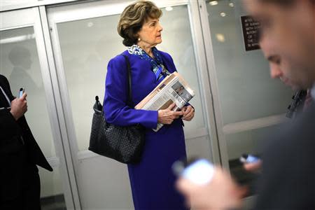 U.S. Senator Dianne Feinstein (D-CA) waits for a subway car with aides as she returns to her office after a floor speech aimed at the CIA's handling of documents related to the Senate Intelligence Committee, at the U.S. Capitol in Washington March 11, 2014. REUTERS/Jonathan Ernst