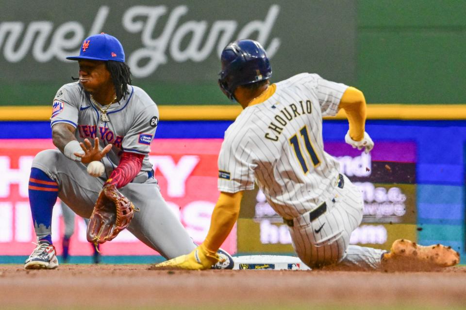 Milwaukee Brewers right fielder Jackson Chourio (11) steals second base as New York Mets shortstop Luisangel Acuna (2) gets the ball in the first inning on Sept. 28, 2024, at American Family Field.