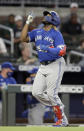 Toronto Blue Jays' Vladimir Guerrero Jr. celebrates after hitting a home run off Atlanta Braves' Bryse Wilson in the sixth inning of a baseball game Tuesday, May 11, 2021, in Atlanta. (AP Photo/Ben Margot)