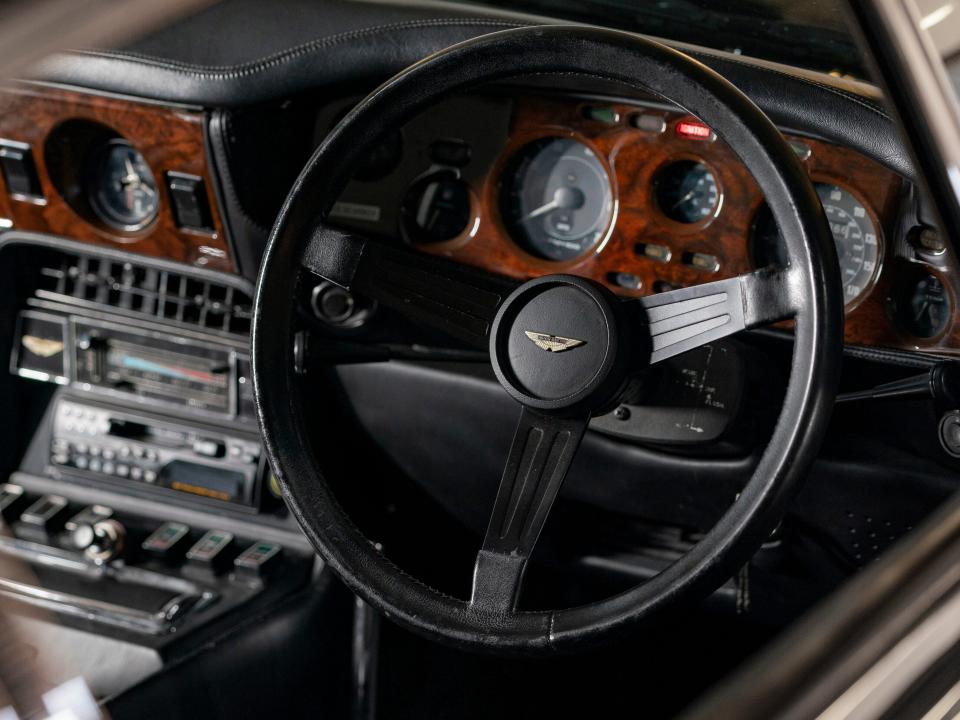 A picture of the steering wheel and interior of No Time to Die.