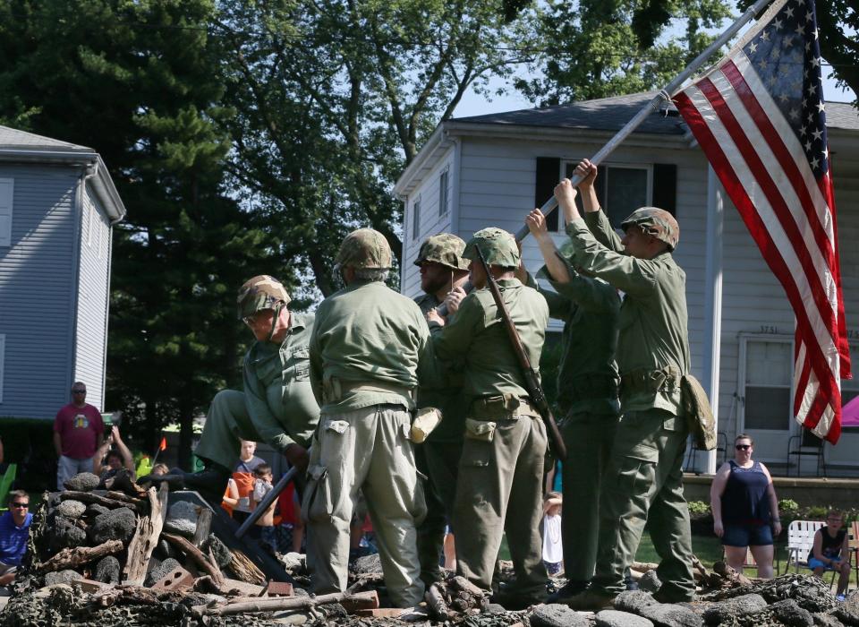 The live reenactment of the raising of the flag at Iwo Jima is a regular sight at the Stow Fourth of July parade.