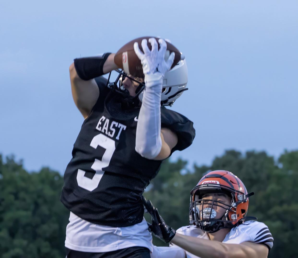 East’s Dylan Errrion catches a pass for his team’s first touchdown of game. Toms River East football beats Barnegat in season opener in Toms River on August 29, 2024.