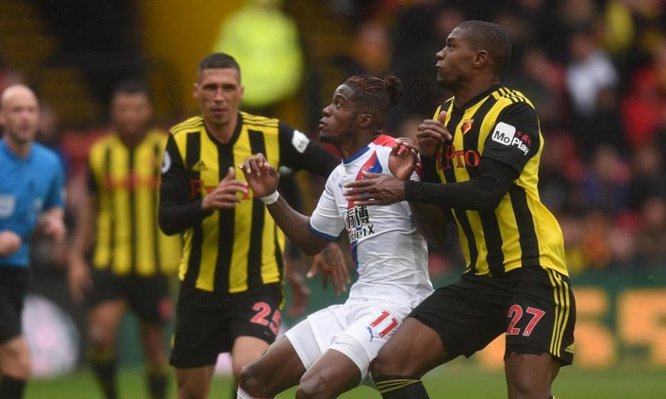 Wilfried Zaha is challenged during Crystal Palace’s game against Watford.