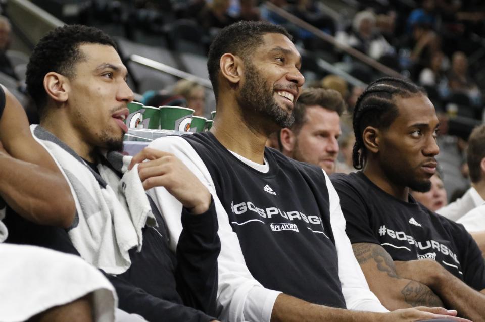 SAN ANTONIO, TX - APRIL 17: Danny Green #14 of the San Antonio Spurs jokes with Tim Duncan #21 during the fourth quarter of Game One of the Western Conference Quarterfinals against the Memphis Grizzlies during the 2016 NBA Playoffs at AT&T Center on April 17, 2016 in San Antonio, Texas.  NOTE TO USER: User expressly acknowledges and agrees that by downloading and or using this photograph, User is consenting to the terms and conditions of the Getty Images License Agreement. (Photo by Ronald Cortes/Getty Images)