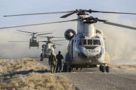 This photo released Tuesday, Jan. 19, 2021, by the Iranian Army, shows helicopters during a military drill. Iran's military kicked off a ground forces drill on Tuesday along the coast of the Gulf of Oman, state TV reported, the latest in a series of snap exercises that the country is holding amid escalating tensions over its nuclear program and Washington's pressure campaign against Tehran. (Iranian Army via AP)