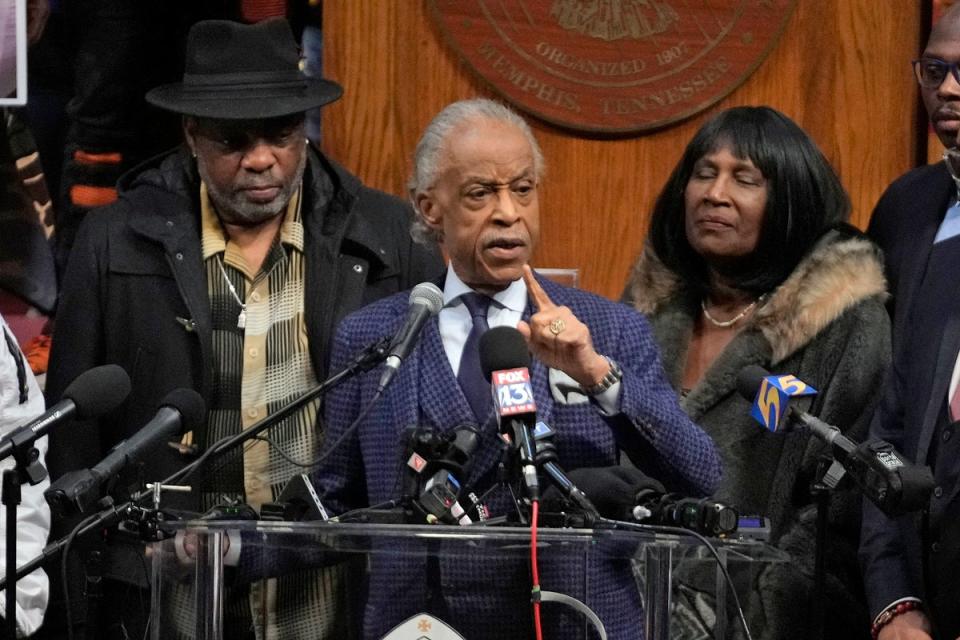 The Rev Al Sharpton speaks at the historic Mason Temple as he is flanked by RowVaughn Wells, right, mother of Tyre Nichols, and Tyre's stepfather Rodney Wells (AP)