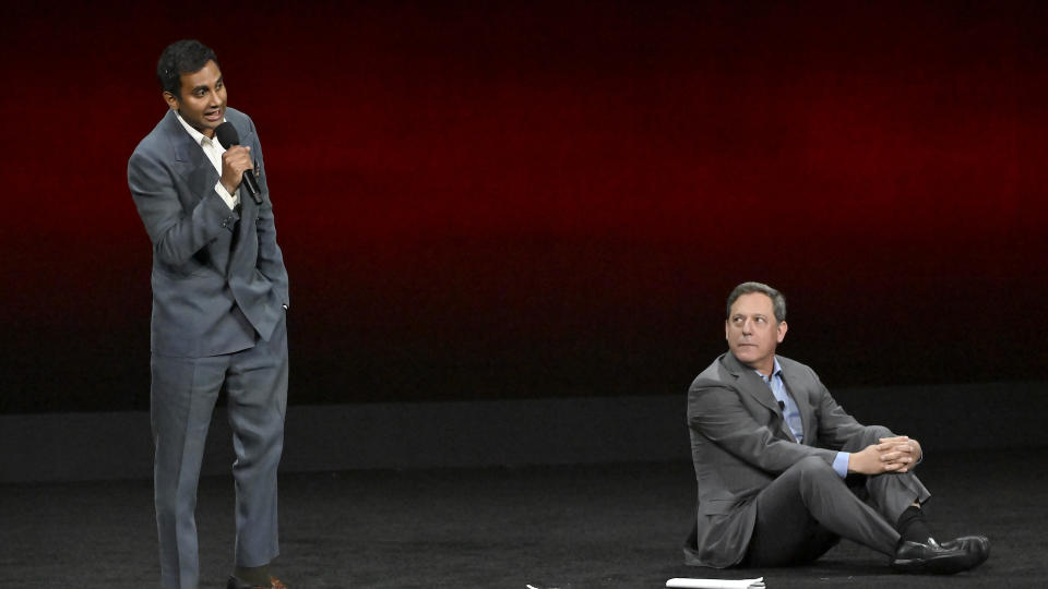 LAS VEGAS, NEVADA - APRIL 10: (L-R) Aziz Ansari and Adam Fogelson, Chairman, Lionsgate Motion Picture Group speak onstage during the Lionsgate Presentation during CinemaCon 2024 at The Colosseum at Caesars Palace on April 10, 2024 in Las Vegas, Nevada. (Photo by David Becker/WireImage)