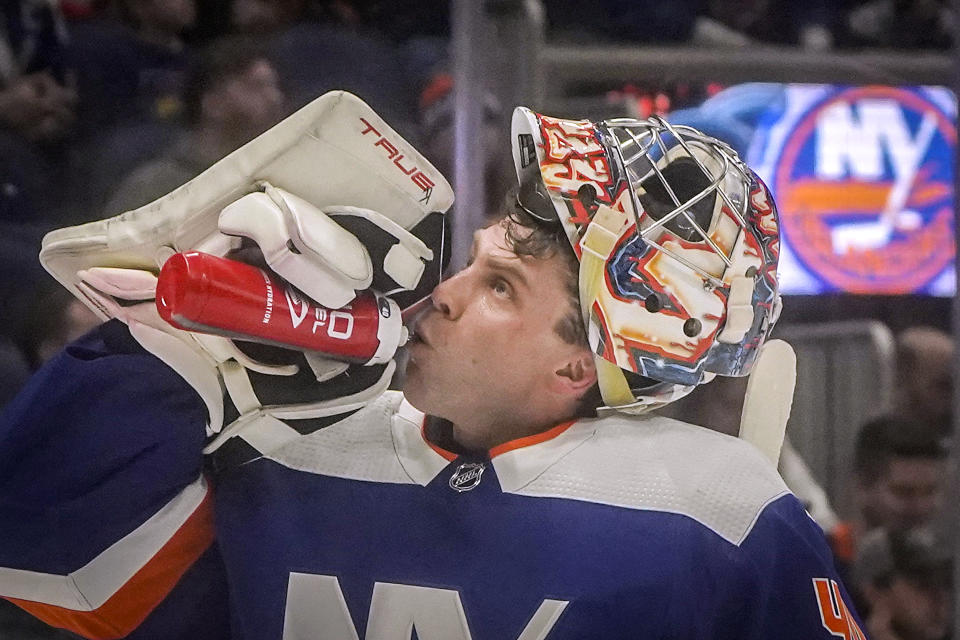 New York Islanders goaltender Semyon Varlamov takes a drink during first period break of an NHL hockey game against the Calgary Flames, Saturday, Feb. 10, 2024, in New York. (AP Photo/Bebeto Matthews)