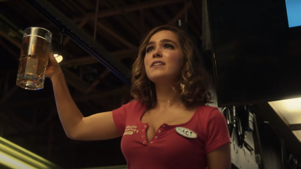 Haley Lu Richardson holding a beer in "Support the Girls"