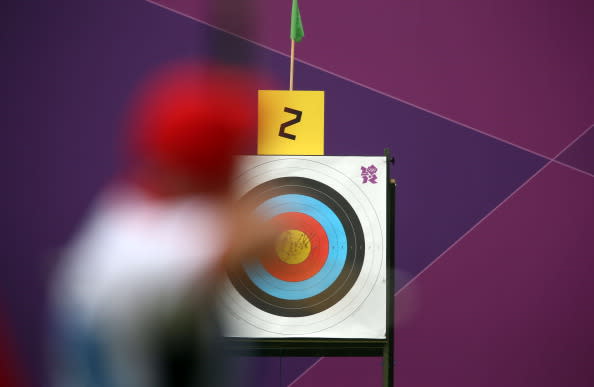 An athlete takes aim during the Archery Ranking Round on Olympics Opening Day as part of the London 2012 Olympic Games at the Lord's Cricket Ground on July 27, 2012 in London, England. (Photo by Paul Gilham/Getty Images)