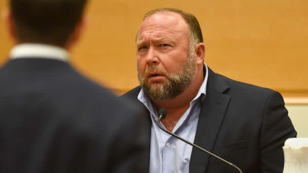 PHOTO: Infowars founder Alex Jones is questioned by plaintiff's attorney Chris Mattei during testimony at the Sandy Hook defamation damages trial at Connecticut Superior Court in Waterbury, Conn., Sept. 22, 2022.  (Tyler Sizemore/Hearst Connecticut Media/Pool via AP)