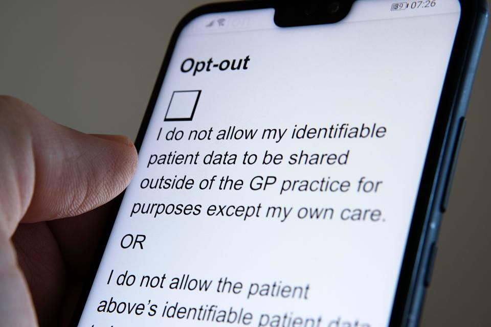 Consent withdrawal form at NHS Digital website seen on the smartphone. Form that stops NHS patient records to be shared with third parties.