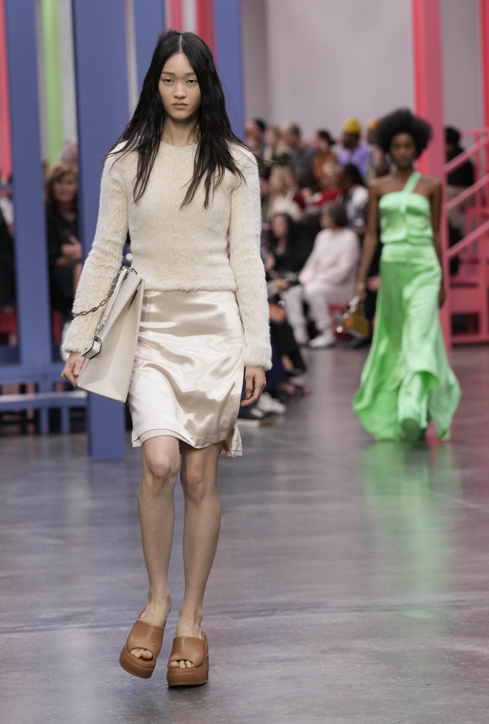 A model wears a creation as part of the Fendi women's Spring Summer 2023 collection presented in Milan, Italy, Wednesday, Sept. 21, 2022. (AP Photo/Antonio Calanni)