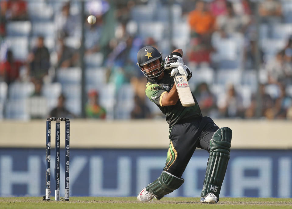 Pakistan batsman Ahmed Shehzad plays a shot during their ICC Twenty20 Cricket World Cup match against Bangladesh, in Dhaka, Bangladesh, Sunday, March 30, 2014. (AP Photo/Aijaz Rahi)