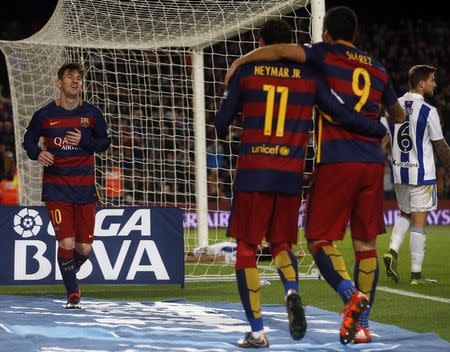 Football Soccer - Barcelona v Real Sociedad - Spanish Liga BBVA - Camp Nou, Barcelona, Spain - 28/11/15 Barcelona's Lionel Messi celebrates scoring the fourth goal with team mates Luis Suarez and Neymar REUTERS/Albert Gea