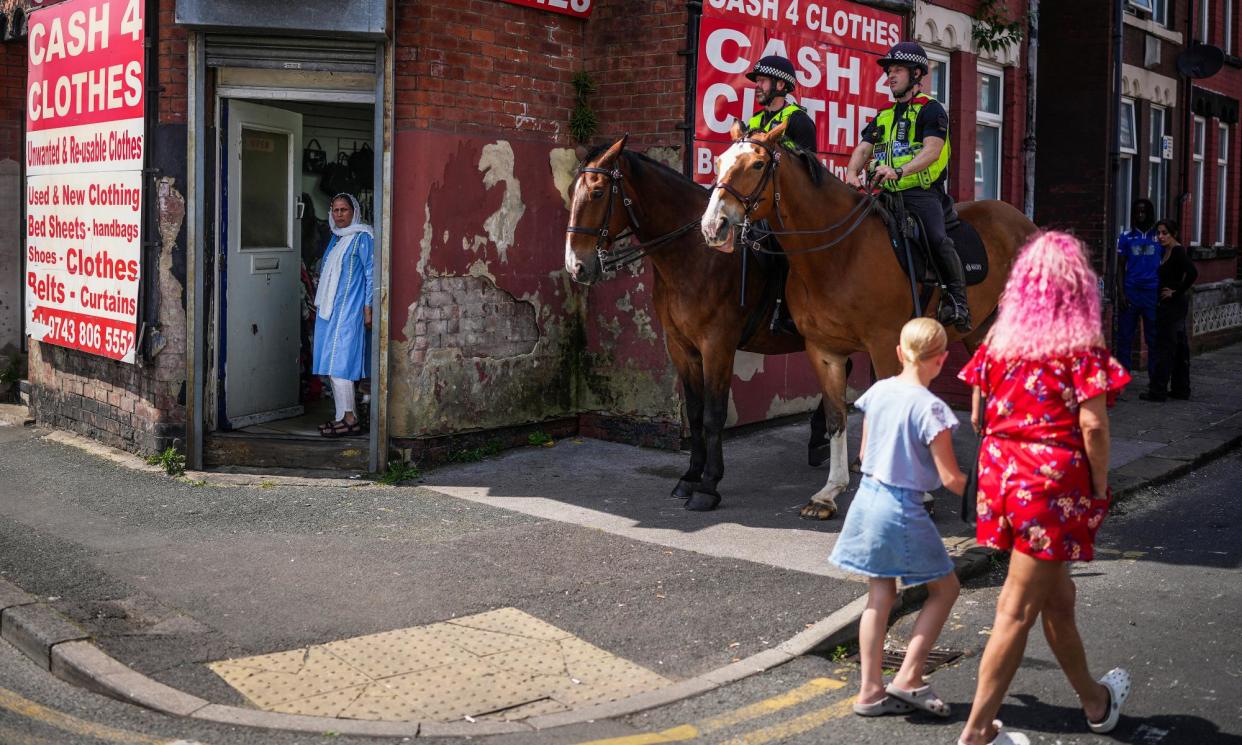 <span>Mounted police on a street in Harehills on the morning after the disturbance. </span><span>Photograph: Christopher Furlong/Getty Images</span>