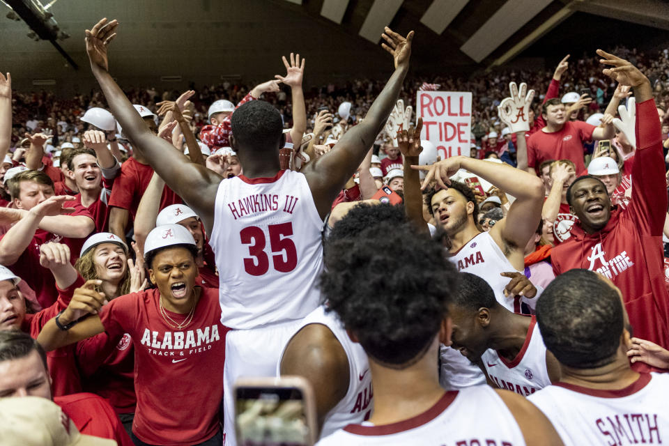 Alabama's Raymond Hawkins (35) encourages the crowd after the team's NCAA college basketball game against Auburn, Wednesday, Jan. 15, 2020, in Tuscaloosa, Ala. (AP Photo/Vasha Hunt)