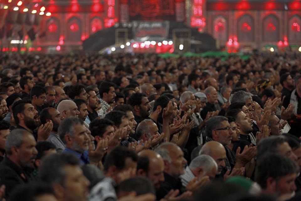 Shiite Muslim worshippers pray inside the holy shrine of Imam Abbas ahead of the Arbaeen festival in Karbala, Iraq, Friday, Oct. 18, 2019. The holiday marks the end of the forty day mourning period after the anniversary of the martyrdom of Imam Hussein, the Prophet Muhammad's grandson in the 7th century. (AP Photo/Hadi Mizban)